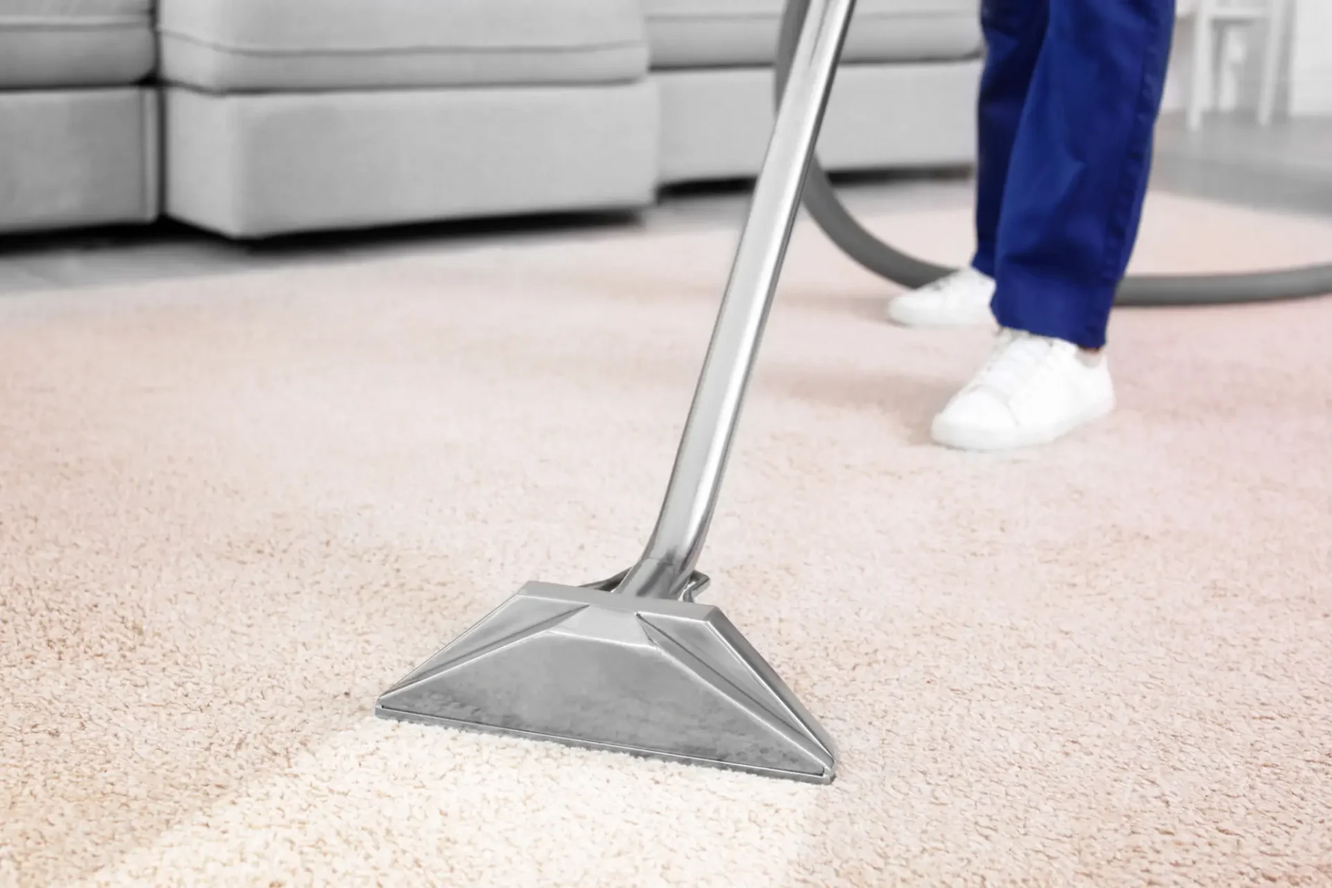 Vacuuming light carpet in living room